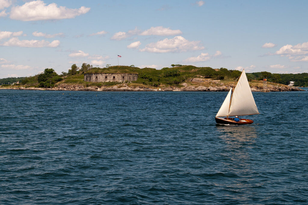 Sailboat sailing near Fort Scrammel casco bay