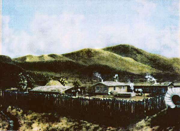 Fort Willden with rock home, log cabin, & dugout. Five Cottonwood trees that charles Willden planted along Cove Creek, the creek winding thru & in front of the fort. A covered wagon passing thru "parked at the right!" There is a woman hanging clothes & a flag flying over the main house- it was both mail stop & telegraph office - also a horse by the shed- W/crop of hay in the background!