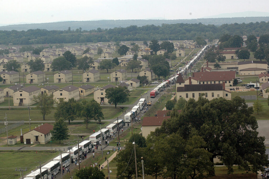 Busses loaded with Hurricane Katrina refugees arrive at Fort Chaffee