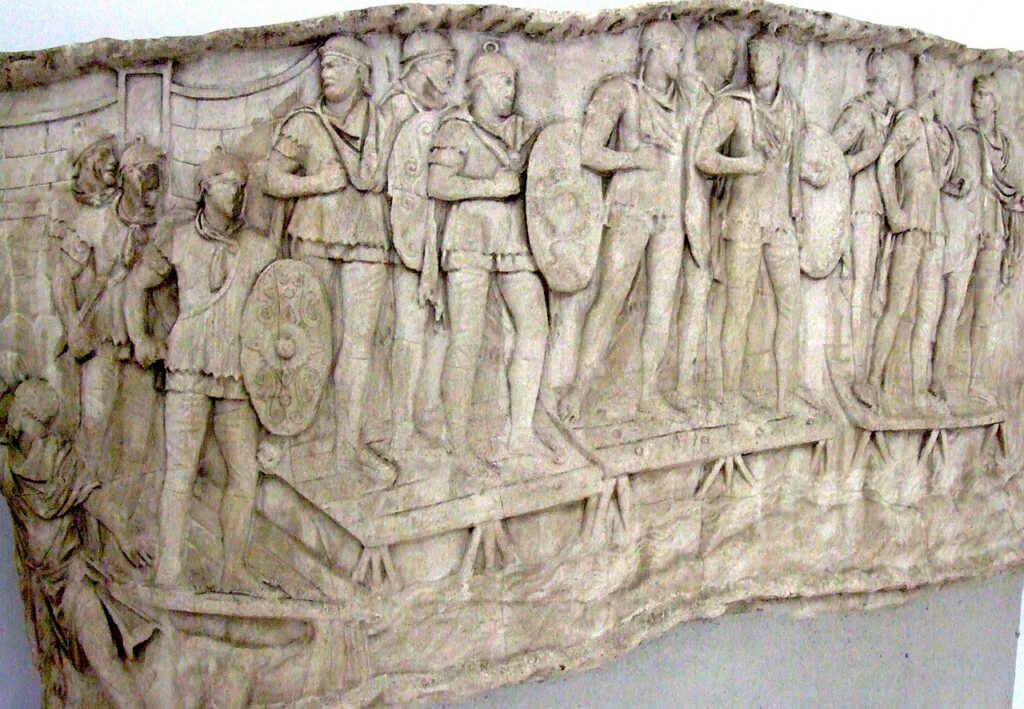 Sculpture of Roman auxiliary infantry crossing a river.