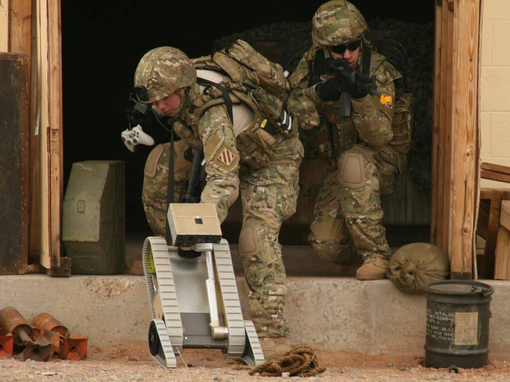 Soldiers from the Future Combat Systems, Evaluation Brigade Combat Team, employ an unmanned vehicle to clear a road during an exercise and live demonstration