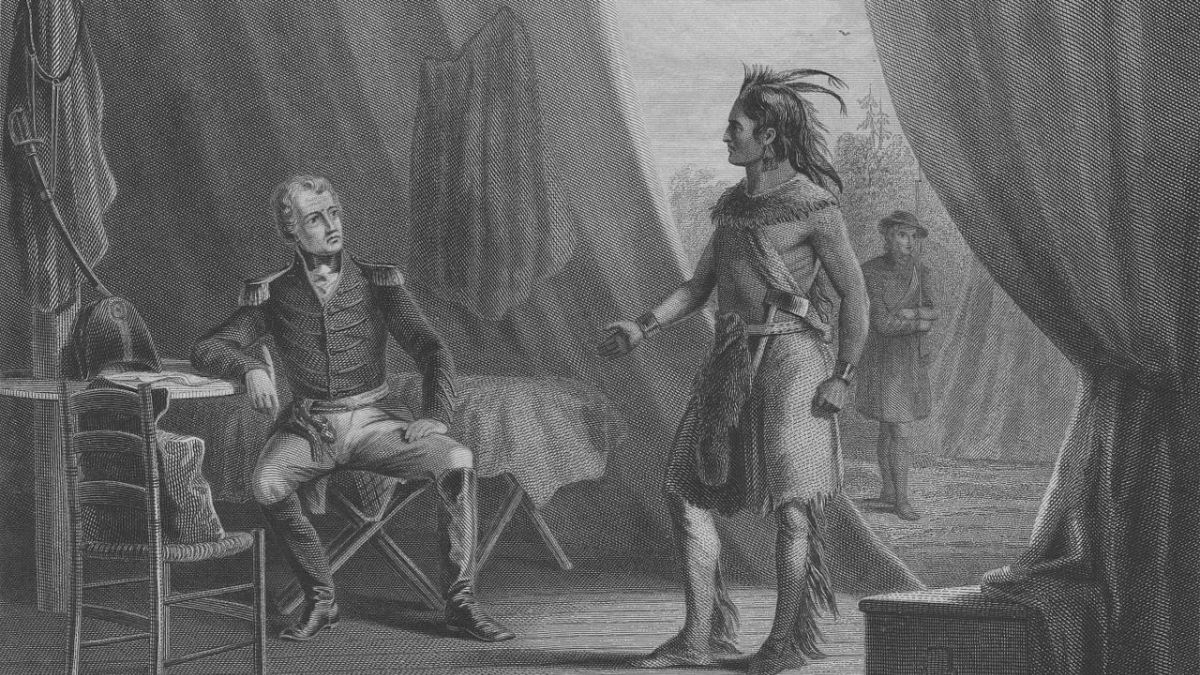 Print shows Andrew Jackson sitting in a chair on the left, in a tent, speaking with William Weatherford who is standing on the right near the opening of the tent.