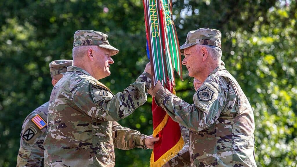 Gen. Glen D. VanHerck, right, Commander, North American Aerospace Defense Command and United States Northern Command, passes the U.S. Army North colors to Lt. Gen. John R. Evans Jr., during the U.S. Army North change of command ceremony at Joint Base San Antonio-Fort Sam Houston, September 9, 2021.